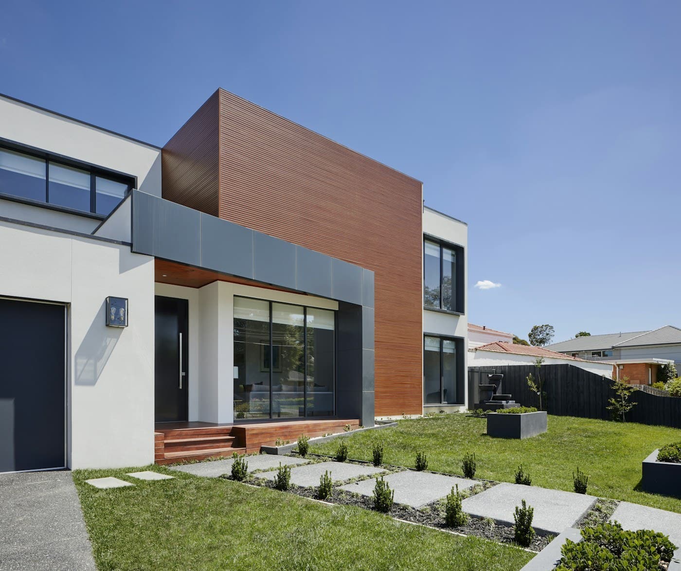 Contemporary residence with expansive glazing and a sheltered outdoor living space